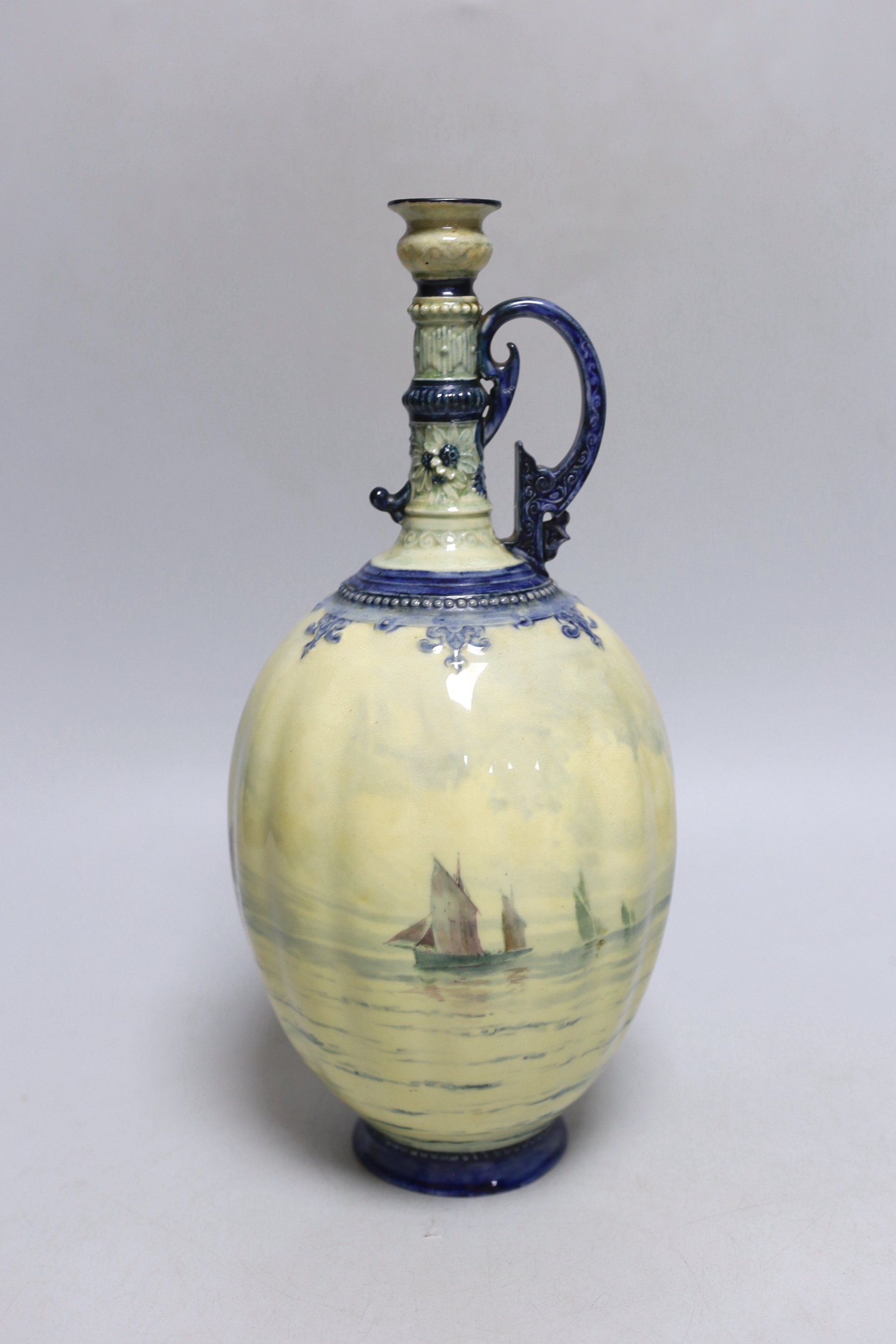 A Royal Crown Derby ewer with a very usual handle, hand painted with a sailing scene with a pale yellow ground by W.E.J. Dean, date mark 1898, 29cm high